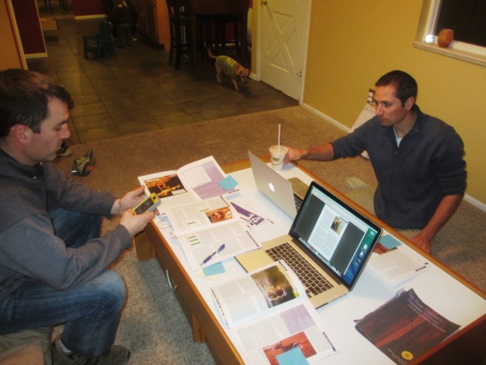 The Fixed Pin brain trust examining each page of the book for errors. Ben on the left, Jason on the right.