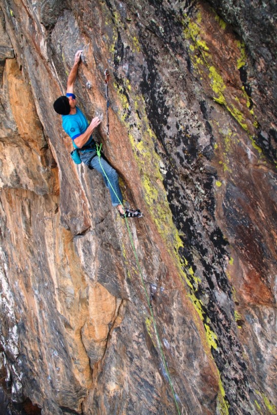 Entering the ‘Impossible’ crux, with my right hand on the incut horn, and left on the lowest ‘razor crimp’.