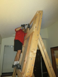 Installing a framing angle between the ceiling and the campus board.