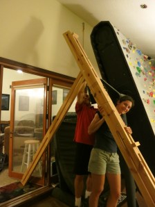 The secondary supports slide into the space in the main support beams and are fastened with a single 5/16" bolt.