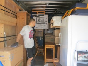 Playing "Tetris" with all our worldly possessions. The Campus board is strapped to the wall to my left.