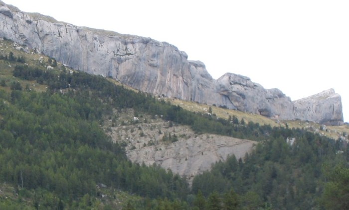 Realization is located on the Sector Biographie, which is the tallest and steepest section of cliff near the center of the photo.