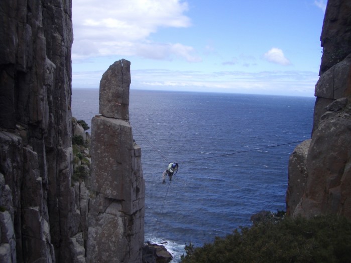 Kate making the Tyrolean Traverse back to the mainland.