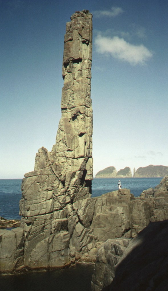 Cape Hauy in the distance.  The slender tower is The Candlestick, which sits about 20 feet east of The Totem Pole.