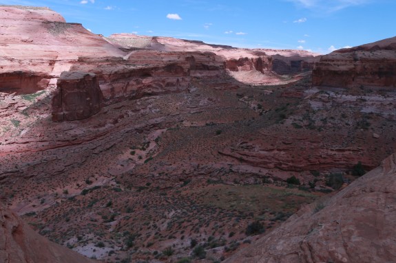 The exit of Larry Canyon requires a steep climb up the canyon wall, but with a breathtaking view.