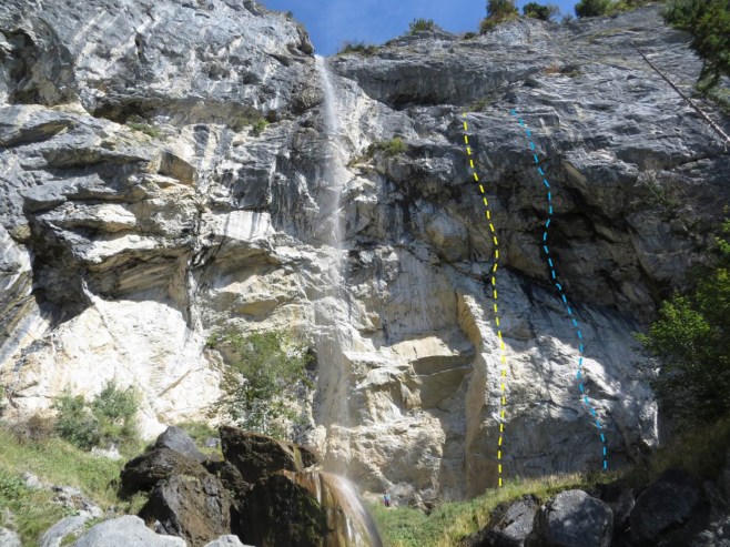 Kate standing below Alex Huber’s two most significant routes, Weisse Rose (L, in yellow) and Open Air (R, in blue). Originally given .14c and .14d (respectively) by Alex, Adam Ondra suggested an upgrade to .14d and .15a when he repeated them in 2008, to align with the “new school” grading. In Ondra’s words: “Now when Action Directe is 9a, Open Air should be 9a+.”