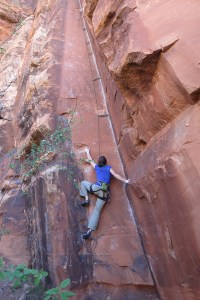 Janelle starting up the OUTSTANDING route, Inner Chi ~ at the Kung Fu Theater crag.