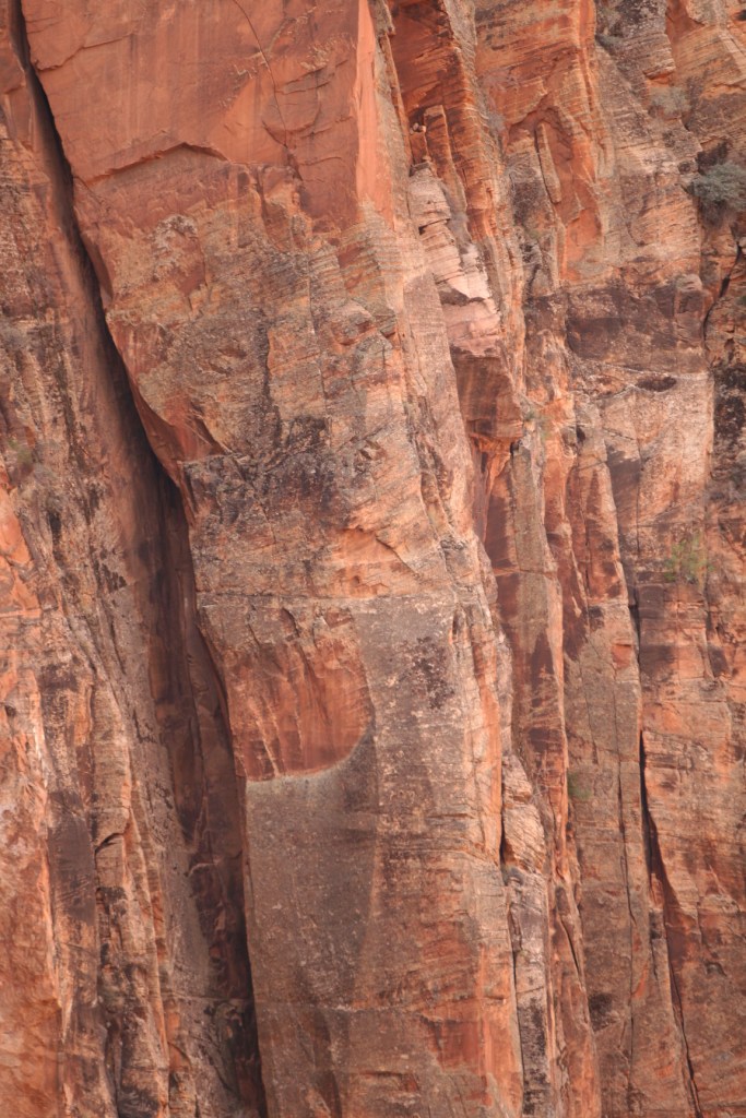 Pitch 3 - Starts from a shallow ledge near the arête. Climbs the arête for about 30 feet, then crosses over to lower angle cracks using awesome patina face holds.
