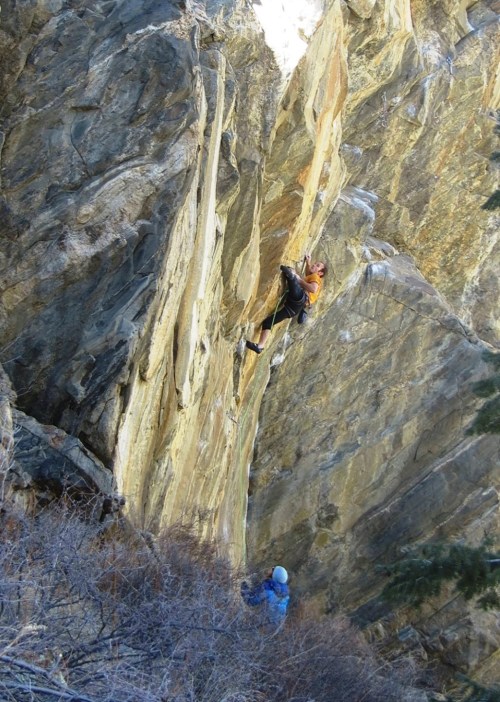 Midway through the second boulder problem.