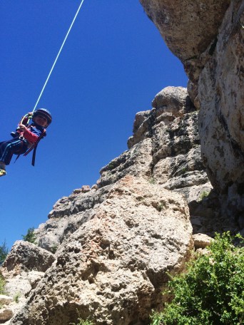 Logan swinging from the lip of Calamity Jane.