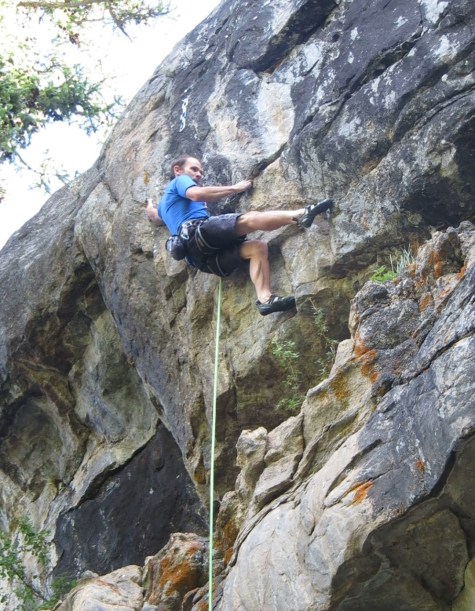 Staring down the ensuing heel hook on the final boulder problem.