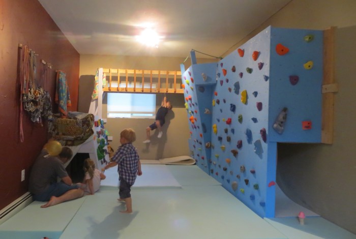 Lucian on the Monkey Bars while Mark S, Ayla, Logan (and Amelie, hidden) play in the slab tunnel.