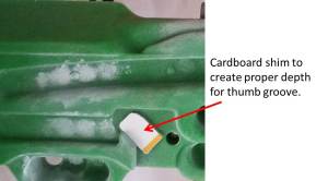 The re-designed Micro Crimp with Thumb Support. I've added some cardboard shim material to make this grip more maniacally heinous for my thumb size. Your thumb will probably fit perfectly :)