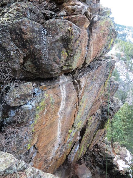 When I saw this wall I knew I'd hit pay dirt. Note the rope which gives an idea of the wall's steepness. The rock on this cliff is flawless.