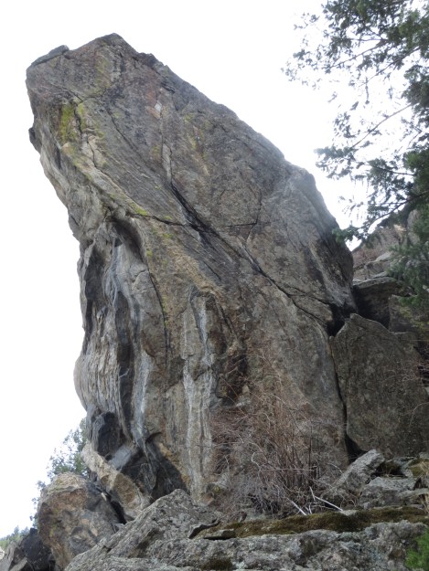 The west face of The Talon. Where Eagles Dare climbs the arête just left of center, essentially following the lime green lichen streak.