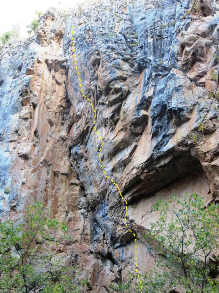 Shadowboxing climbs the gently overhanging sweep of porcelain limestone directly across from The Eighth Day.