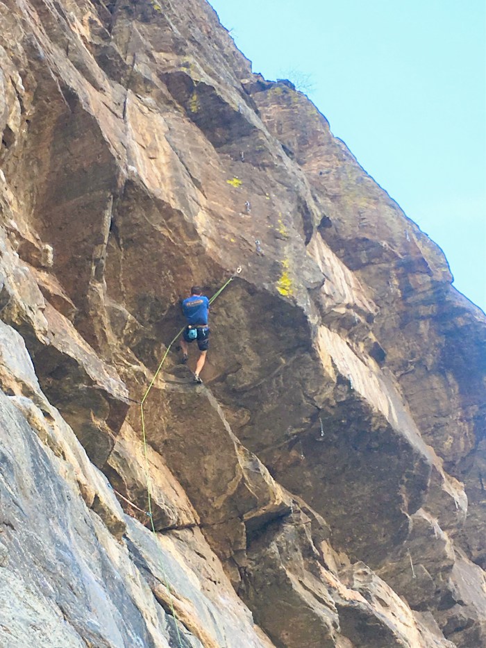 The Wall of the 90s' "last great roof problem" climbs out to the swath of dark brown stone ten feet left of Harlot.